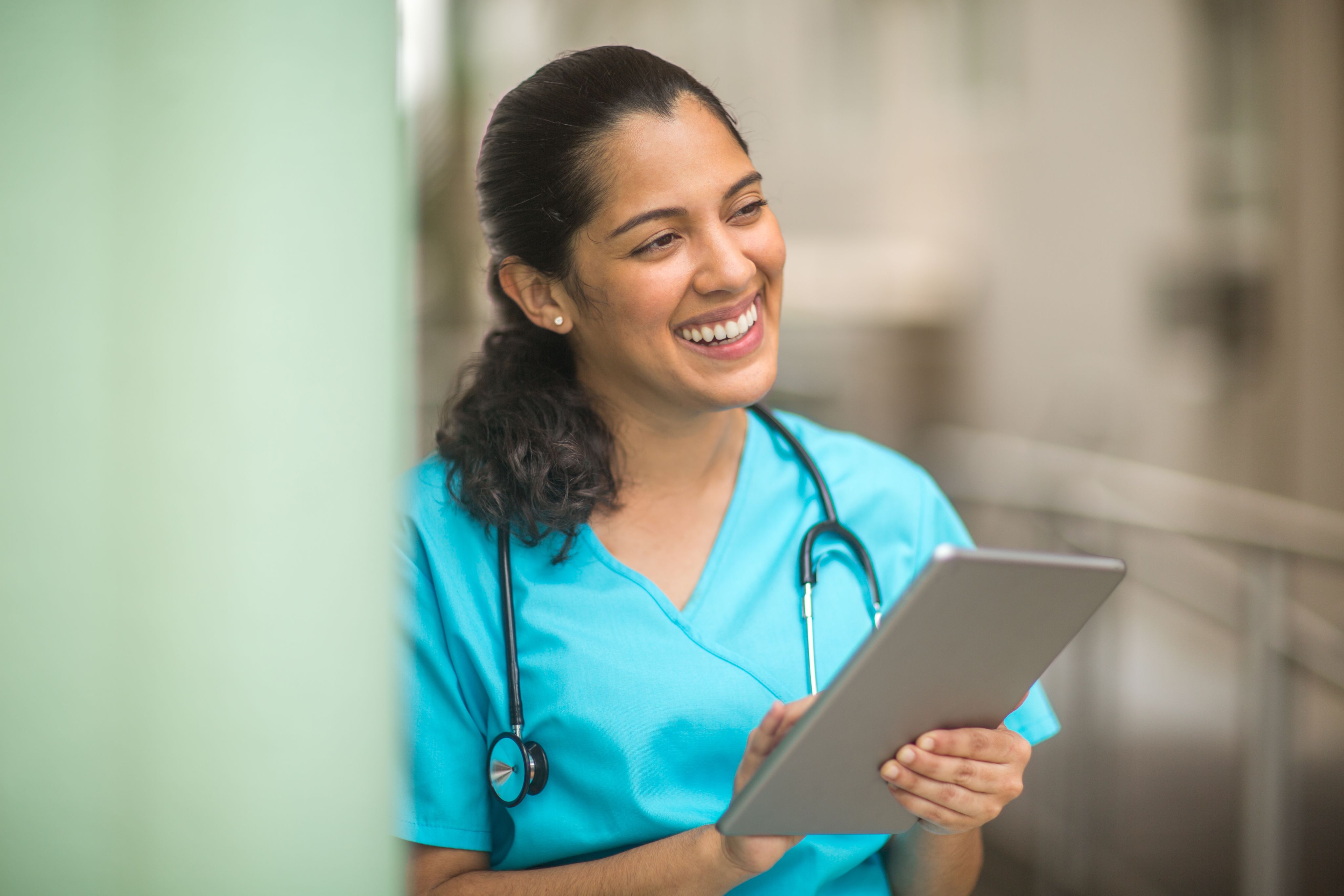 Smiling female healthcare professional at work.